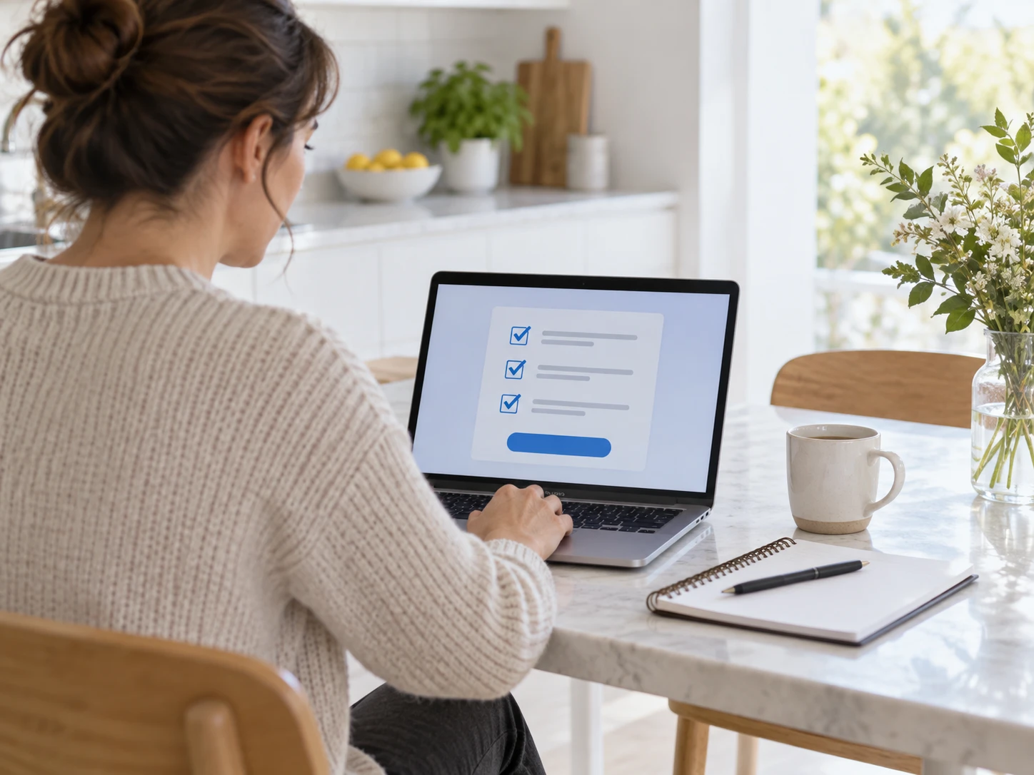 A parent at a bright kitchen table with an open laptop showing an abstract sign-up form with three checkboxes; a cup and a notebook beside it. No sampling kit, no medical objects in frame.…